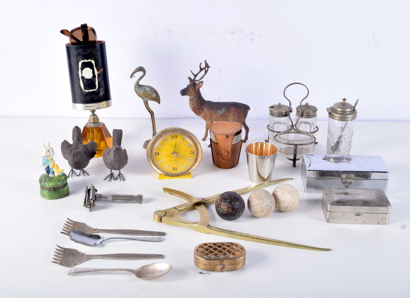 A Miscellaneous collection of vintage metal and glass items , vintage golf balls, birds, animals, cl