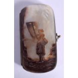 A 19TH CENTURY EUROPEAN CARVED MOTHER OF PEARL PURSE formed with a figure holding a net. 12 cm x 6 c