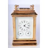 A CARRIAGE CLOCK WITH DAY AND DATE DISPLAY. 5cm X 4.3cm X 10cm (incl handle)