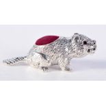 A SILVER PIN CUSHION IN THE FORM OF A BEAVER. Stamped 925, 1.8cm x 5cm, weight 17.4g