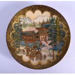 A 19TH CENTURY JAPANESE MEIJI PERIOD SATSUMA DISH painted with figures within a landscape. 17.5 cm d