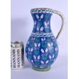 A LARGE TURKISH OTTOMAN IZNIK FAIENCE TYPE WATER JUG painted with motifs. 26 cm x 12 cm.
