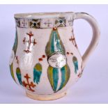 AN OTTOMAN TURKISH KUTAHYA HOLY WATER CUP painted with figures. 9 cm x 9 cm.