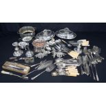A large collection of silver plated items serving dishes, flatware, wine holders, candle sticks etc