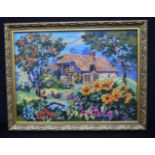 A framed wool needle point picture of a cottage and flowers 36 x 48 cm.