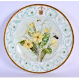 A LATE 19TH CENTURY FRENCH SEVRES PORCELAIN PLATE painted with a coat of arms and flowers. 22 cm dia