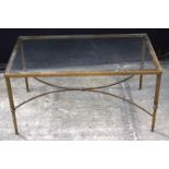 An antique glass topped brass table 47 x 92 x 55 cm.