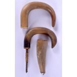 THREE 19TH CENTURY MIDDLE EASTERN CARVED RHINOCEROS HORN WALKING CANE HANDLES. 277 grams. 10.5 cm x