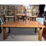 A LARGE ARTS AND CRAFTS TYPE SINGLE PLANK TABLE decorated with motifs, together with 3 chairs. 80 cm