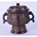 A 19TH CENTURY CHINESE TWIN HANDLED BRONZE CENSER AND COVER decorated in the archaic style. 11 cm x