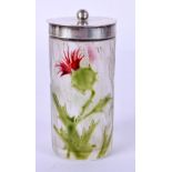 A SMALL FRENCH CLEAR GLASS JAR AND COVER enamelled with green foliage. 7.5 cm high.