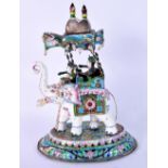 AN EARLY 20TH CENTURY INDIAN SILVER AND ENAMEL MODEL OF AN ELEPHANT modelled with attendants. 1245 g