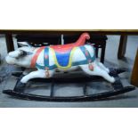 A RARE ANTIQUE PAINTED CARVED WOOD FOLK ART ROCKING PIG. 75 cm x 142 cm x 39 cm.