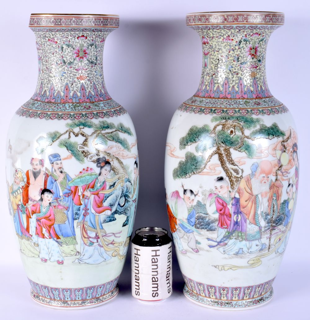 A LARGE PAIR OF CHINESE REPUBLICAN PERIOD FAMILLE ROSE VASES painted with figures and foliage. 44 cm