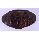 AN 18/19TH CENTURY EUROPEAN CARVED COQUILLA NUT SNUFF BOX decorated with a military figure. 8 cm x 5