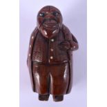 AN 18/19TH CENTURY EUROPEAN CARVED FRUITWOOD TREEN SNUFF BOX in the form of a rotund man. 7.5 cm x 4