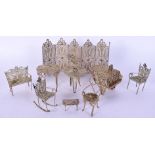 A SUITE OF ANTIQUE MINIATURE CONTINENTAL SILVER FURNITURE. Largest 8 cm x 14 cm. (9)