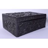 A 19TH CENTURY ANGLO INDIAN CARVED EBONY CASKET decorated with scrolling vines. 30 cm x 18 cm.