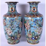 A LARGE PAIR OF 19TH CENTURY CHINESE CLOISONNE ENAMEL VASES decorated with foliage. 27 cm high.