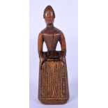 AN 18/19TH CENTURY EUROPEAN CARVED FRUITWOOD TREEN SNUFF BOX in the form of a standing female. 12 cm