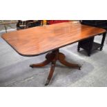 A LARGE VICTORIAN MAHOGANY FOLDING TILT TOP BREAKFAST TABLE upon scrolling base. 73 cm x 148 cm x 97