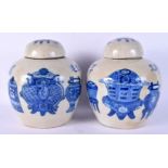 A RARE PAIR OF 19TH CENTURY CHINESE BLUE AND WHITE GINGER JARS AND COVERS Kangxi style. 21 cm x 14 c