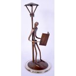A VINTAGE FIGURE OF A STYLISED MALE modelled under a lamp post. 21 cm high.