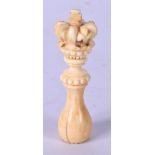 AN ANTIQUE IVORY SEAL STAMP in the form of a miniature tip staff, with unscrewing crown terminal, ch