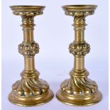 A PAIR OF 18TH CENTURY EUROPEAN BRONZE CANDLESTICKS. 15 cm high.