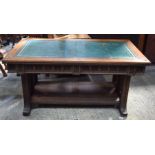 AN ARTS AND CRAFTS GOTHIC REVIVAL OAK LEATHER INSET DESK in the manner of Pugin. 152 cm x 74 cm x 84