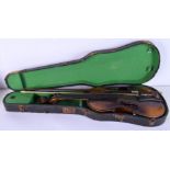 A CASED VINTAGE VIOLIN with bow. 57.5 cm long. (2)