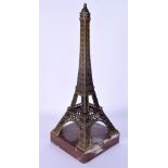AN UNUSUAL EARLY 20TH CENTURY FRENCH BRONZE AND MARBLE MODEL formed as the Eiffel tower. 27 cm high.
