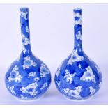 A PAIR OF LATE 19TH CENTURY JAPANESE MEIJI PERIOD BLUE AND WHITE VASES painted with flowers. 16.5 cm