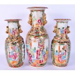 A SET OF THREE 19TH CENTURY CHINESE CANTON FAMILLE ROSE VASES Qing. Largest 28 cm high. (3)