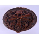 AN 18/19TH CENTURY EUROPEAN CARVED COQUILLA NUT SNUFF BOX decorated with arms and medals. 8 cm x 5 c