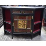 AN AESTHETIC MOVEMENT EBONISED CABINET decorated with a bird. 77 cm x 105 cm x 40 cm.