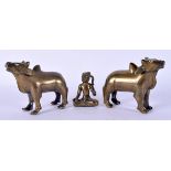 A PAIR OF 19TH CENTURY INDIAN BRONZE FIGURES OF COWS together with a bronze deity. Largest 11 cm x 8