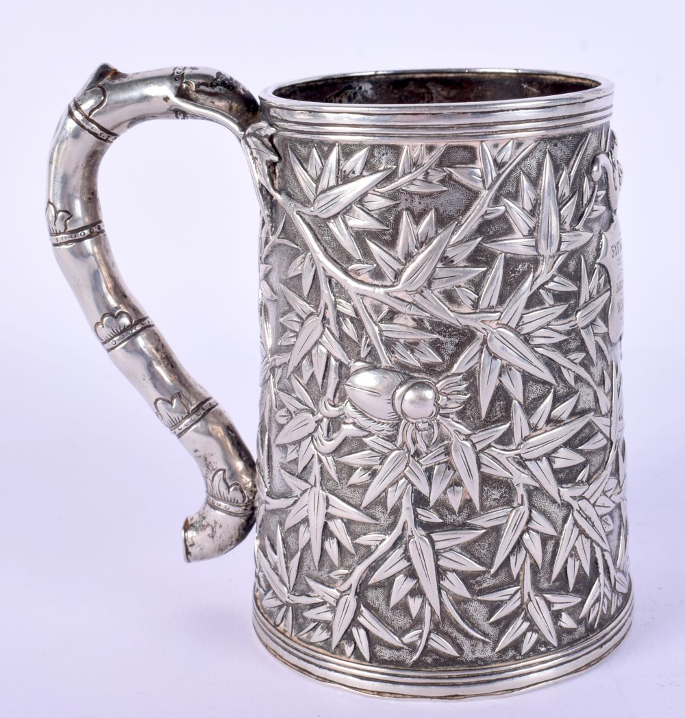 A 19TH CENTURY CHINESE EXPORT SILVER MUG smothered in bamboo shoots. 203 grams. 10 cm high.