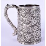 A 19TH CENTURY CHINESE EXPORT SILVER MUG smothered in bamboo shoots. 203 grams. 10 cm high.