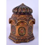 A 19TH CENTURY INDIAN LACQUERED WOOD JAR AND COVER painted with floral sprays. 18 cm x 10 cm.