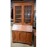 A LARGE ARTS AND CRAFTS STYLE DISPLAY CASE BUREAU BOOKCASE. 290 cm x 102 cm x 45 cm.