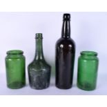 AN ANTIQUE GLASS BOTTLE together with three other old glass jars. Largest 30 cm high. (4)