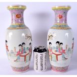 A PAIR OF CHINESE REPUBLICAN PERIOD FAMILLE ROSE VASES painted with figures. 33 cm high.
