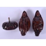 TWO FINE AND RARE CHINESE QING DYNASTY CARVED NUTS finely carved as buddhistic figures. Largest 7 cm
