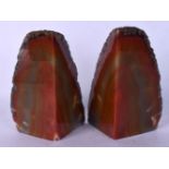 A PAIR OF BRAZILIAN LAVA STONE BOOK ENDS. 17 cm x 8 cm.