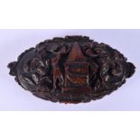 AN 18/19TH CENTURY EUROPEAN CARVED COQUILLA NUT SNUFF BOX decorated with a dogs. 8 cm x 5 cm.