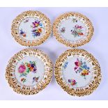 A SET OF FOUR EARLY 20TH CENTURY GERMAN PORCELAIN PLATES painted with flowers. 18 cm wide. (4)