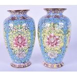 A FINE PAIR OF CHINESE QING DYNASTY CANTON ENAMEL VASES painted with bold foliage and vines. 14 cm h