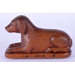 AN 18/19TH CENTURY EUROPEAN CARVED FRUITWOOD TREEN SNUFF BOX in the form of a dog. 11 cm x 7 cm.