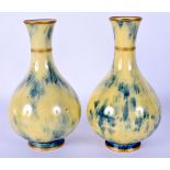 A PAIR OF LATE 19TH CENTURY SEVRES PORCELAIN VASES with gilt banding. 16 cm high.
